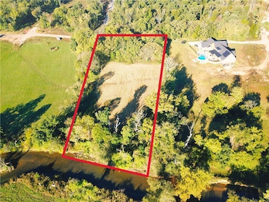 The land backs up to the Osage Creek. The area right along the creek is in a flood zone. The red border is not exact and just for an approximate idea of the land boundaries.