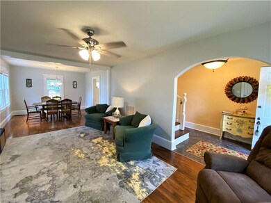 Living room with view of entry and dining room