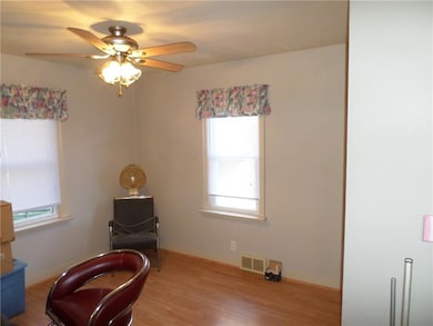 Back Bedroom of main floor.  Laminate floor and ce