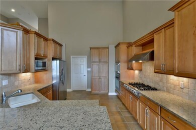 Quality kitchen with granite counters, tiled backs