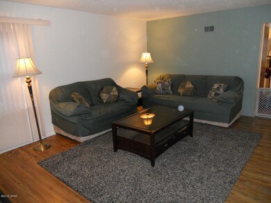Large living room with hardwood floors