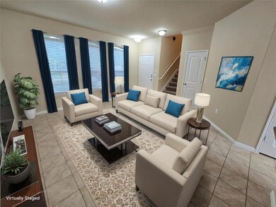Tiled living room featuring stairs and baseboards