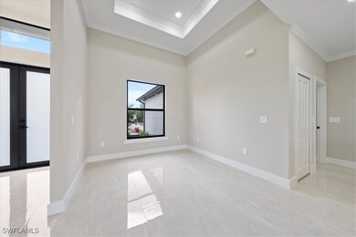 Spare room with recessed lighting, french doors, b