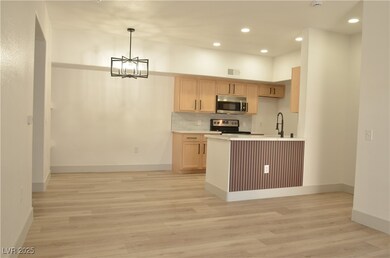 Kitchen featuring light wood-style flooring, visib