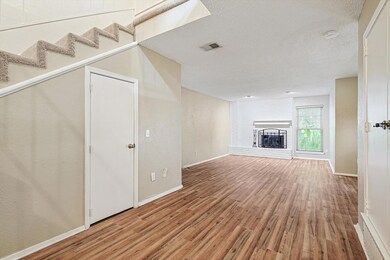 Entry way looking into flex space and living room 
