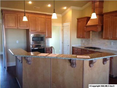 View of large corner home site, over sized 3 car side entry garage, full brick with hardi trim,