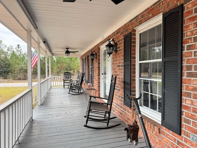 Deck featuring ceiling fan and a porch