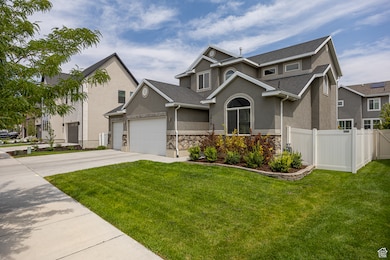 View of front facade with concrete driveway, stucco siding, an attached garage, and a shingled roof