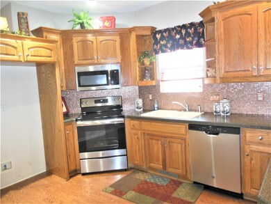 Kitchen With New Stainless Steel Appliances and Pa