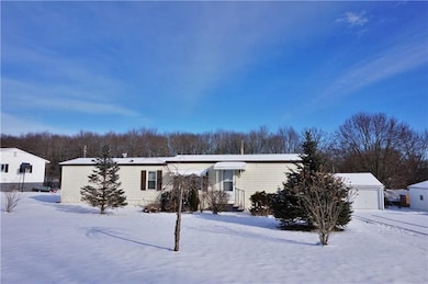 Two bedroom home with a 3 stall detached garage.