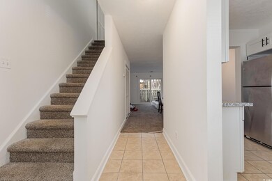 Staircase featuring tile patterned floors
