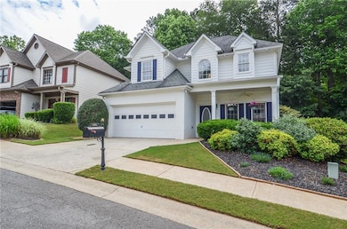 Traditional-style home featuring driveway, a garag