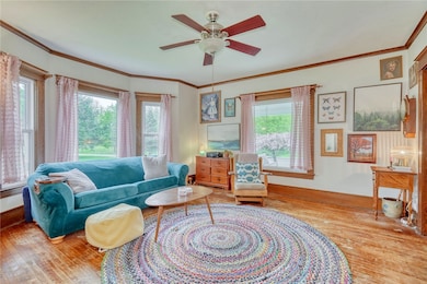 Family Room with hardwood floors, wood trim and ov