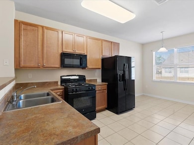 Open kitchen to living room with breakfast space