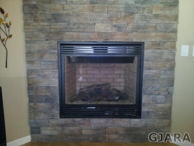 Rock Faced Ceiling to Floor Gas Fireplace