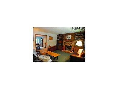 Cozy Family Room with real wood burning fireplace.