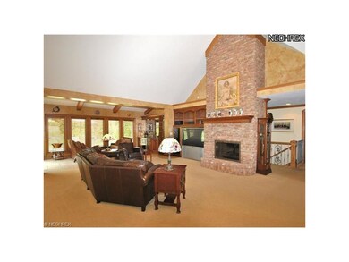 The spacious Great room opens to bright sun room.