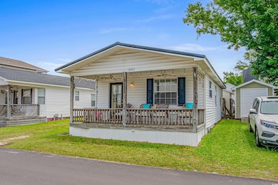 View of front of home with covered porch, an outdo