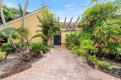 View of front of property with a pergola