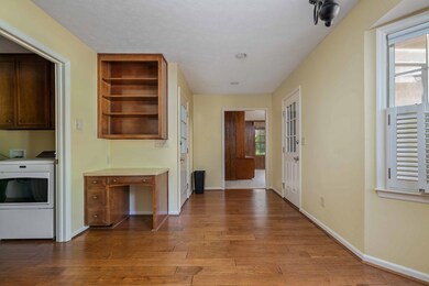 Hallway to garage, den or back yard.