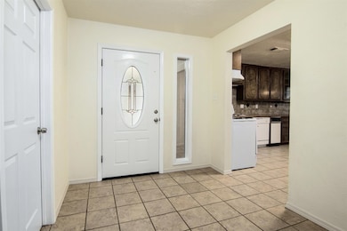 Foyer into your new home with neutral paint throughout.