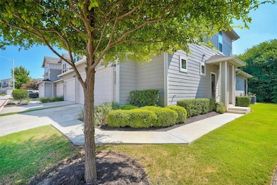 View of side of property featuring a yard, concre