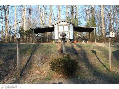 Storage. 8 x 12 storage building in back with shelters on each side