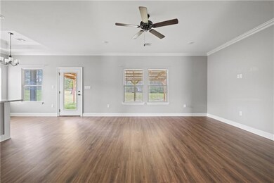 The living room opens to the dining area and the k