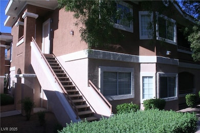 View of home's exterior featuring stairway and stu