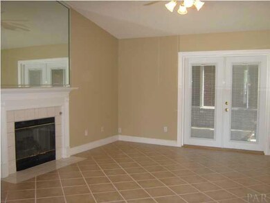 Great room with french doors to florida room that is heated and cooled