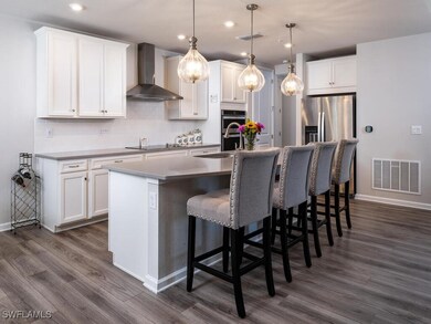 Kitchen featuring visible vents, a kitchen island