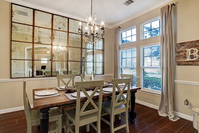 Beautiful formal dining area for holidays and other special occasions.  Tasteful chandelier anchors this area nicely.  Note the neutral walls which you will find throughout the home.