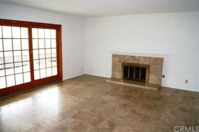 Family Room with Wood Sliders and Travertine Tile