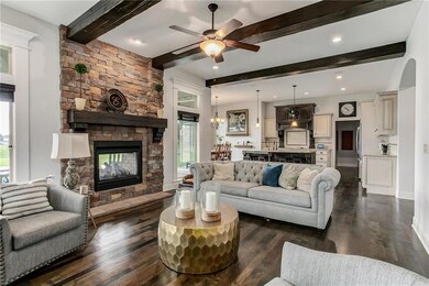The amazing great room highlights a stacked stone 