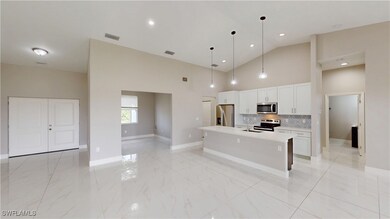 Kitchen featuring stainless steel appliances, a si