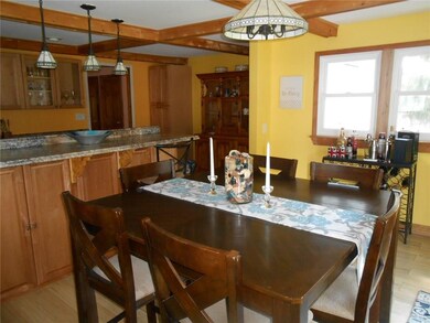 The dining area is next to the sliding glass door 