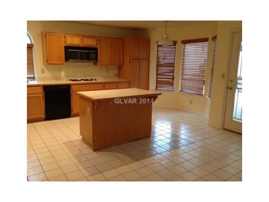 Property Photo. The kitchen has a center island an