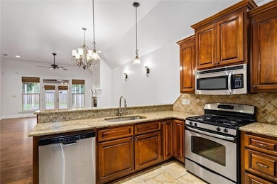 Kitchen with appliances with stainless steel finis