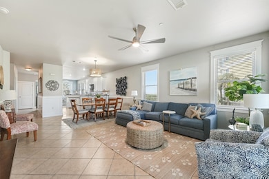 The open-concept design keeps the living, dining, and kitchen areas connected, creating the perfect environment for entertaining and family gatherings.