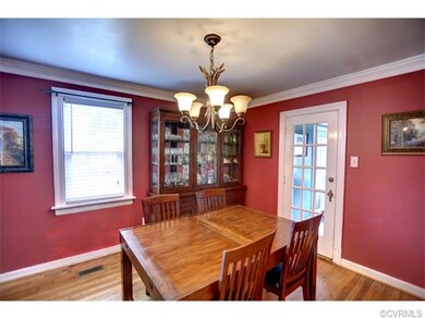 Dining room with hardwood floor, chandelier, two-m
