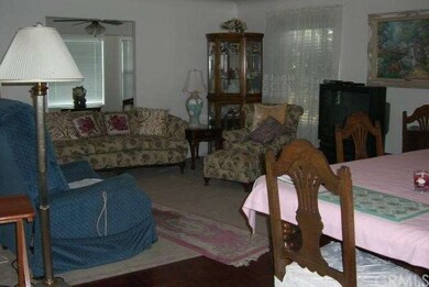 Living room and sun room view from kitchen