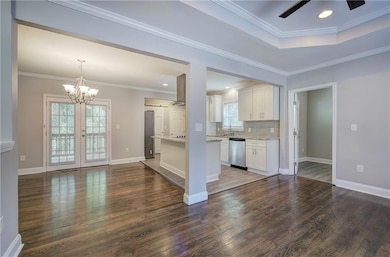 Kitchen with dark hardwood / wood-style floors, wh