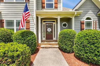 Property entrance featuring roof with shingles