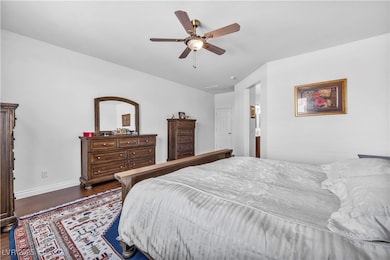 Bedroom featuring wood finished floors and ceiling fan