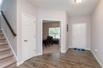The large foyer is great for greeting guests!  Plenty of space for a console table or cubby organizers if you choose! Check out the beautiful flooring too - definitely makes a statement!