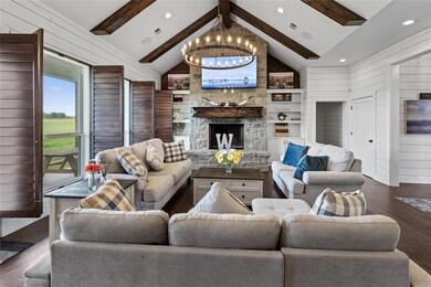 Living room featuring wood walls, an inviting chan