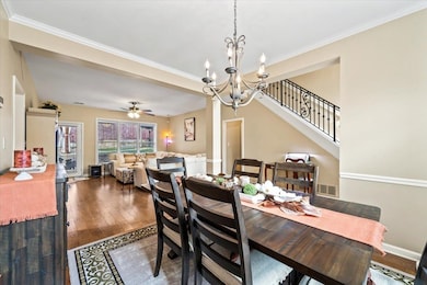 Dining room featuring a chandelier, wood finished 