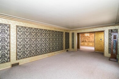 Striking crown molding and detailed woodwork.