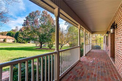 Huge front porch welcomes you to the home.  Set up your rocking chairs and enjoy the quiet setting.