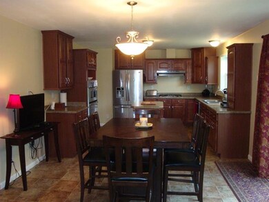 Large kitchen/dining area with backyard access.